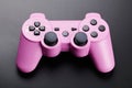 Pink video game controller, joystick for game console isolated on black background Royalty Free Stock Photo