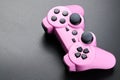 Pink video game controller, joystick for game console isolated on black background Royalty Free Stock Photo