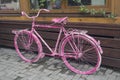 Pink vintage bicycle as a cafe decoration Royalty Free Stock Photo