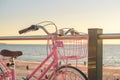 Pink vintage bicycle parked next to the beach Royalty Free Stock Photo