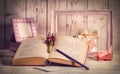 Vintage frame, night lamp and pile of paper on the white vintage table Royalty Free Stock Photo