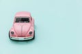 Pink vintage retro toy car isolated on blue pastel colorful background Royalty Free Stock Photo