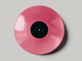 Pink vinyl record with a black hole in the middle Royalty Free Stock Photo