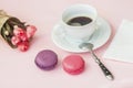 Pink and vioet macarons, macaroons, spring flowers, top view. Romantic morning, gift for beloved. Breakfast on Valentin