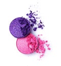 Pink and violet crushed shiny eyeshadows on white Royalty Free Stock Photo