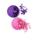 Pink and violet crushed shiny eyeshadows on white Royalty Free Stock Photo