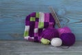 Pink, violet, magenta, white and green plaid and balls. Cotton yarn for knitting, crochet. The beginning of bright plaid, checkere Royalty Free Stock Photo