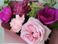 pink and violet rose anemon carnation bouquet close up