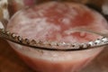 Pink Vodka drink in glass punch bowl