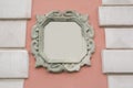 Pink wall decorated with stucco and molding. Space for text Royalty Free Stock Photo