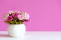 Pink wall with flower pink rose on shelf white wood, copy space for text Royalty Free Stock Photo