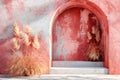 A pink wall with a red archway and some tall grass in front of it. Generative AI Royalty Free Stock Photo