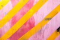 Pink wall with yellow diagonal stripes