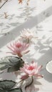 Pink water lilies adorn a white table, adding beauty to the landscape Royalty Free Stock Photo