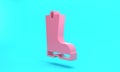 Pink Waterproof rubber boot icon isolated on turquoise blue background. Gumboots for rainy weather, fishing, gardening