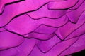 Pink wavy background. Abstraction. Textured relief wall