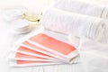 Pink waxing strips, cream and body oil Royalty Free Stock Photo