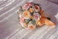 Pink wedding bouquet with orange bow Royalty Free Stock Photo