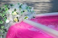 Pink wedding car bonnet with bouquet of flowers Royalty Free Stock Photo