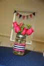 Pink Wedding Flowers in Mason Jar Decorating Table in Reception