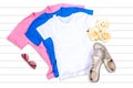 Pink, White and Blue T-shirts Flat Lay on a White Background Royalty Free Stock Photo