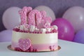 Pink and white cake with the number 10 and hearts on the table with balloons. Birthday, anniversary