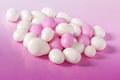 Pink and white candy dragees.