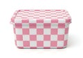 A pink and white checkered plastic container with a lid for food storage Royalty Free Stock Photo