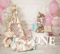 pink and white decoration for a 1st birthday cake smash studio photo shoot with balloons, paper decor, cake and topper Royalty Free Stock Photo