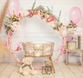 pink and white decoration for a 1st birthday cake smash studio photo shoot with balloons, paper decor, cake and topper Royalty Free Stock Photo