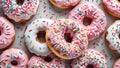 Pink and white donuts with colorful sprinkles,. Pastel candy colors. Royalty Free Stock Photo