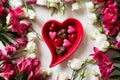 Pink and white flowers with chocolate candies heart shape Royalty Free Stock Photo