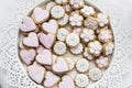 Pink and white glazed cookie biscuits on tray