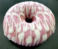 Pink and white iced donut Royalty Free Stock Photo