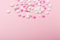 Pink and white pills on pink background. Heap of assorted various medicine tablets and pills. Health care Royalty Free Stock Photo