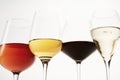 Pink, white, red, sparkling alcoholic drinks in wine glasses. Royalty Free Stock Photo