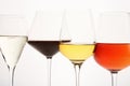 Pink, white, red, sparkling alcoholic drinks in wine glasses. Royalty Free Stock Photo