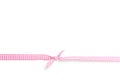 Pink and white rips textile ribbon with bow on white background Royalty Free Stock Photo