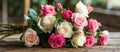 Pink and White Roses Bouquet on Wooden Table Royalty Free Stock Photo