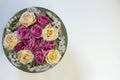 Pink and white roses and limonium in a bowl with water on a white background Royalty Free Stock Photo