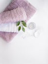 Pink and white towels with cotton pads and ear sticks on the white background Royalty Free Stock Photo