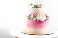 Pink and white wedding bunk cake with fresh flowers decoration Royalty Free Stock Photo