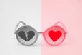 Pink whole heart and gray broken heart on pink glasses