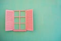 Pink window with sashes on the blue wall Royalty Free Stock Photo