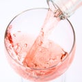 Pink wine being poured