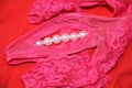 Pink women panties decorated by white pearls