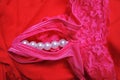Pink women panties decorated by white pearls