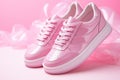 Pink women's leather sneakers without logo on a pink background. Youth shoes. Side view