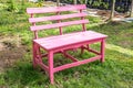 Pink wooden bench in the garden background Royalty Free Stock Photo