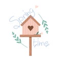 Pink wooden birdhouse in flowers with lettering Spring time, plant twigs and flowers Royalty Free Stock Photo